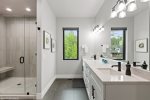 Master en-suite bathroom with tile shower
